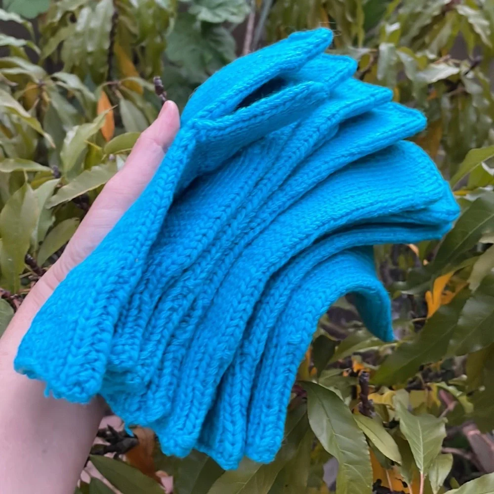 New turquoise hand knitted wool mittens